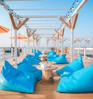 a deck on a cruise ship with blue pillows
