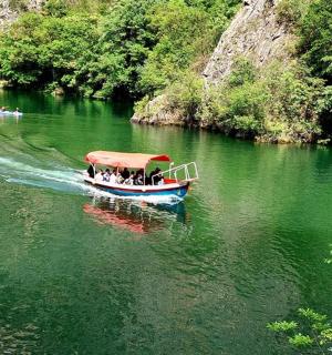 a group of people on a boat on a river