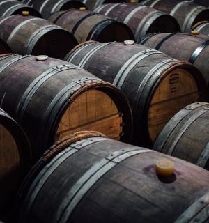 a bunch of wooden barrels in a row