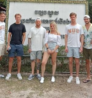 a group of people standing in front of a building