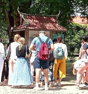 a group of people standing in front of a temple