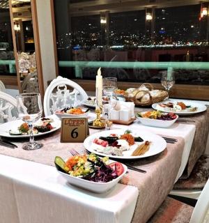 a table with plates of food on it with a view