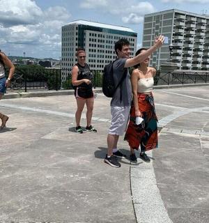 a group of people standing on top of a roof