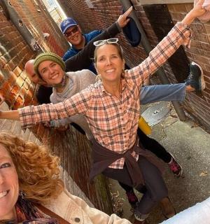 a group of people holding their arms in the air