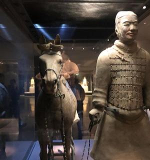 a statue of a man and a horse in a museum