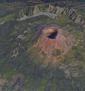 an aerial view of a hole in a mountain