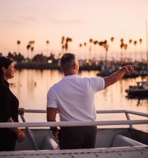 a man and a woman on a boat in the water