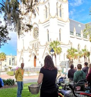 a group of people standing in front of a church