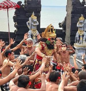 a group of men standing in front of a temple