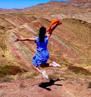 a person jumping in the air with a frisbee