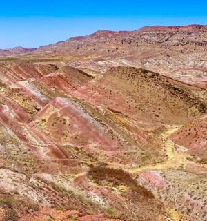 an aerial view of a desert mountain range
