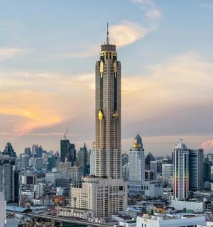 a city skyline with a tall skyscraper