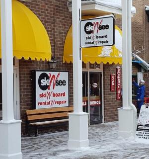 a store with signs in front of a building
