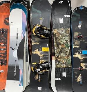 a group of snowboards lined up next to each other