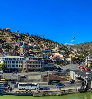 a city with a bridge over a river and a city