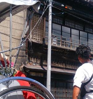 a man standing in front of a building