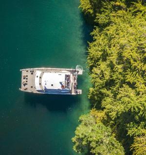 an aerial view of a boat in a lake