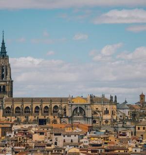 a large building with a clock tower in a city