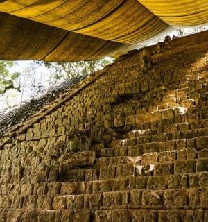 a brick wall with a roof on top of it
