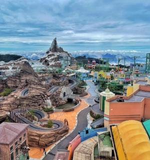 a view of a water park with a roller coaster