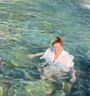 a woman in the water in a body of water