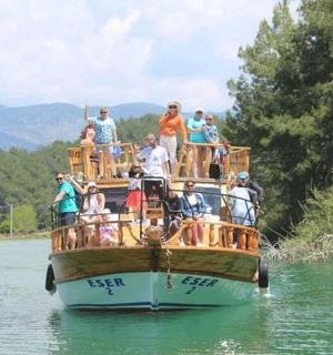 a group of people on a boat in the water
