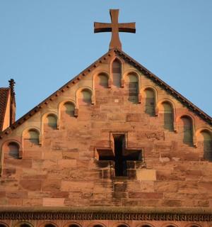 a church with a cross on the top of it