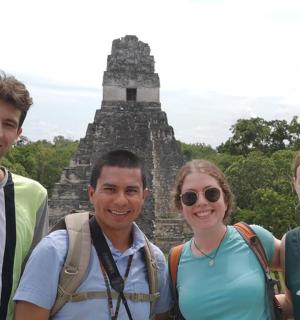 a group of people standing in front of a temple