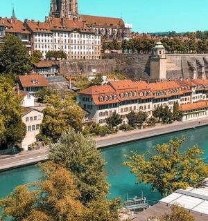an aerial view of a city with a river