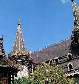 a building with two towers on top of it