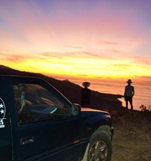 a black truck with a white sticker on the side