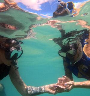 two people are floating in the water