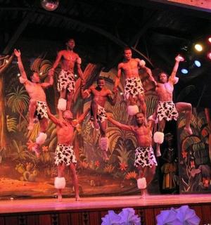 a group of dancers performing on a stage