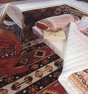a painting of a harpsichord on a rug with a book
