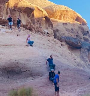 a group of people climbing up a mountain