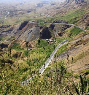 a winding road on the side of a mountain
