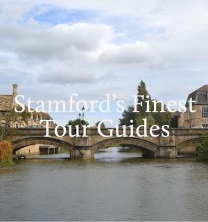 a bridge over a river in a city with buildings