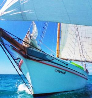 a man on a sail boat in the ocean