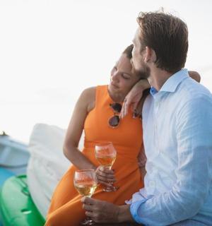 a man and a woman holding glasses of wine