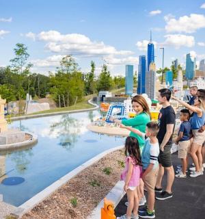 a group of people looking at the statue of liberty