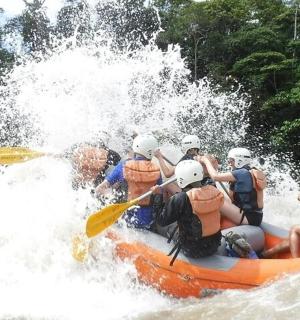 a group of people in a raft on a river