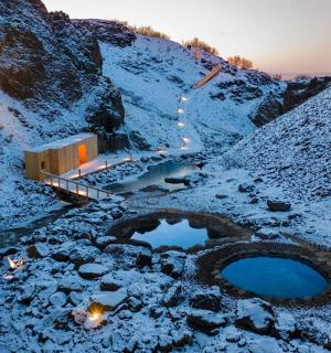 a building on a mountain with snow on it