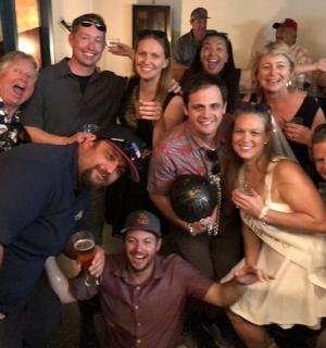 a group of people posing for a picture at a party