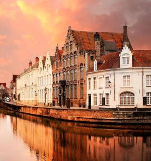 a group of buildings next to a river