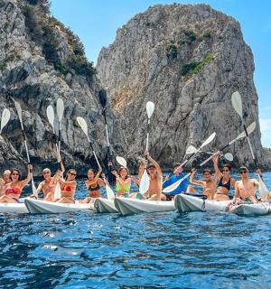 a group of people in kayaks in the water