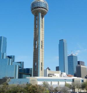 a view of a city skyline with a tower