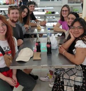 a group of people sitting at a table with drinks