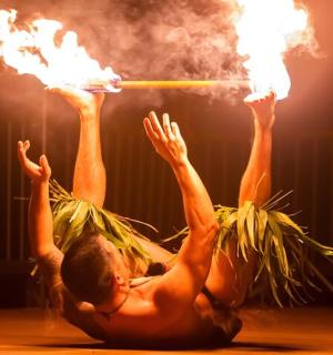 a man is holding up a fire stick