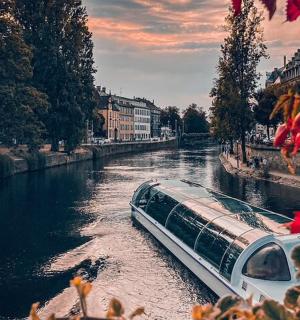 a boat traveling down a river in a city