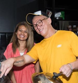 a man and a woman standing in a kitchen